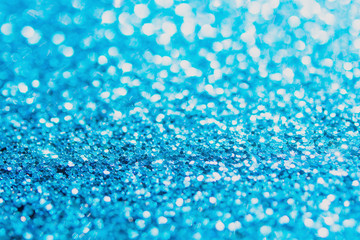 Defocused blue glitter background. blue abstract bokeh background. Christmas abstract background.