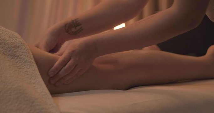 Young woman relaxing during body massage , 4k UHD	