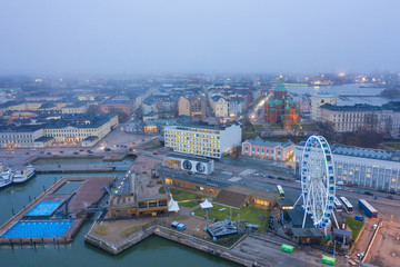 HELSINKI, FINLAND - NOVEMBER 2019: Helsinki. Finland. Ferris wheel in Helsinki. The embankment of the quay of Katajanokka. Uusimaa. Impressions from travel to Scandinavia.