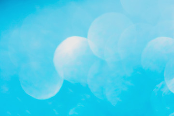 Defocused blue glitter background. blue abstract bokeh background. Christmas abstract background.