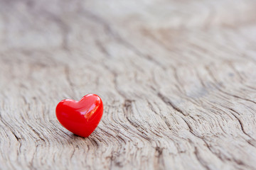 Fototapeta premium Valentines Day background with red hearts on plank wooden, copy space.