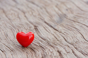 Fototapeta premium Valentines Day background with red hearts on plank wooden, copy space.