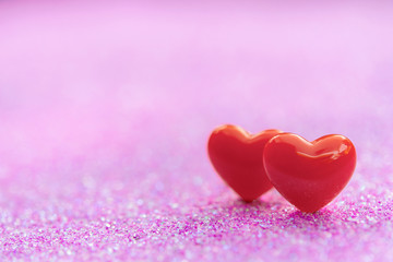 Valentines Day background with Red heart shapes on abstract light pink glitter background, Copy space