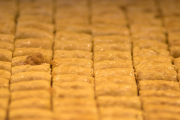 Baklava (modern Middle Eastern Arab-style dessert) baked with sugar and honey syrup, sweet and stuffed with almonds, nuts, chocolate or pistachios. In the old market, Jerusalem.