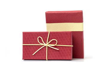 Red gift box and 100 US Dollars isolated on a white background.