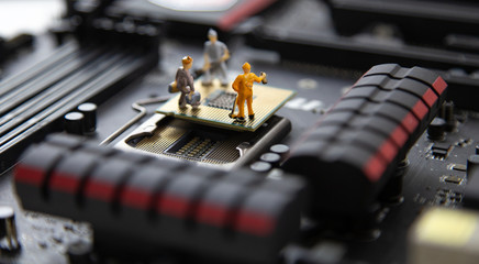 miniature people Motherboard and  CPU repair, Concept: working in technical teams,