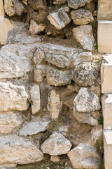 Structure of natural stones close-up. The stones are piled high.