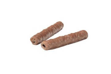 two chocolate tubules on a white isolated background