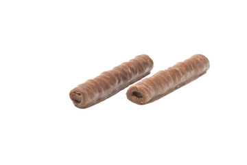 two chocolate tubules on a white isolated background