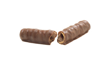 broken into two halves chocolate tubule on a white isolated background