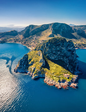 Top down view from flying drone. Amazing morning scene of Zafferano cape with old lighthouse. Incredible  spring seascape of Mediterranean sea, Sicily, Italy, Europe. Traveling concept background.