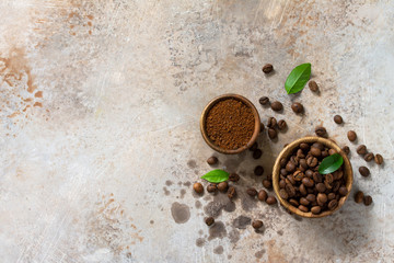 Coffee background. Coffee beans and ground powder on a stone concrete tabletop. Top view flat lay background. Copy space.