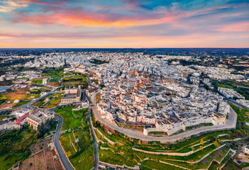 View from flying drone. Splendid morning cityscape of Ostuni town. Fantastic sunrise in Apulia,...