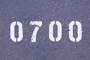 Number 1650 stenciled on the asphalt in white paint.