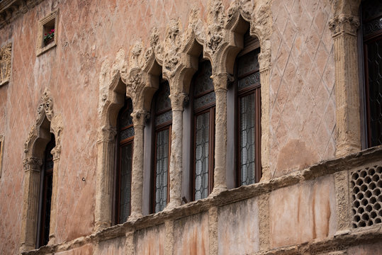 Old mullioned windows in Venetian style tuff in Padua, Italy.