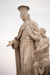 Fototapeta na wymiar Statue of Antonio Mori in Prato della Valle, Padua, Italy. Andrea Memmo is depicted in a Venetian toga, the left hand rests on a woman who expresses the ancient city of Padua