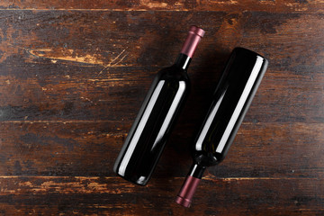 bottled wine on wooden background