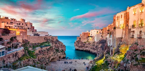 Wall murals Mediterranean Europe Spectacular spring cityscape of Polignano a Mare town, Puglia region, Italy, Europe. Colorful evening seascape of Adriatic sea. Traveling concept background..