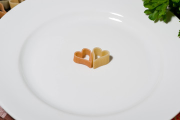 heart-shaped pasta on a white plate