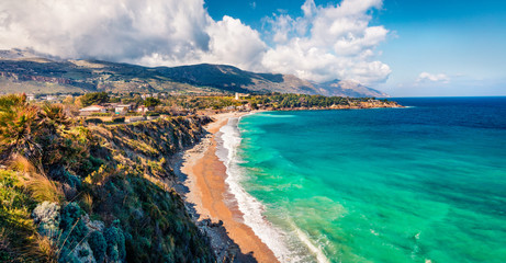Fototapeta premium Picturesque morning view of popular italian destination - Guidaloca beach, Scopello location, Sicily, Europe. Amazing summer seascape of Mediterranean sea, Italy.