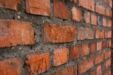 Brick wall. The seam is made of cement. Texture and construction.