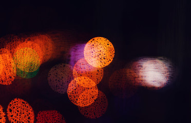 blurred lights of the night city on a dark background