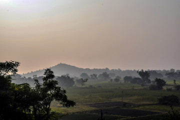 Picture of early morning sun rise view in indian village