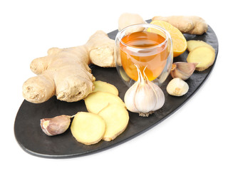 Fresh garlic and other natural cold remedies isolated on white