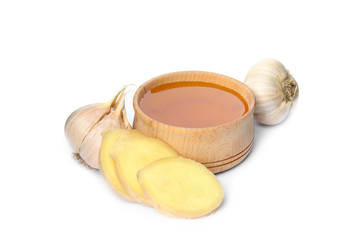 Fresh garlic and other natural cold remedies isolated on white