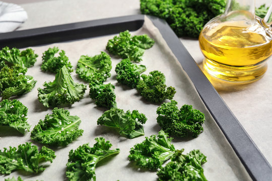 Raw Cabbage Leaves On Baking Sheet, Closeup. Preparing Kale Chips