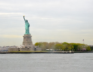 Fototapeta premium Statue of Liberty on a small island next to Manhattan New York in the USA