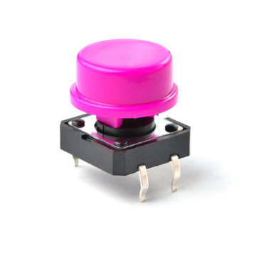 Small electronic tactile toggle push button switch with purple hat isolated on white background.