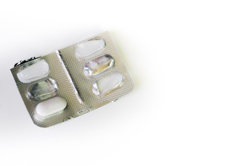 Empty pill box. White pill in plastic cap and aluminum foil from the opposite side. Pharmaceutical...