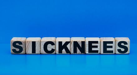 concept word disease on cubes on a blue background