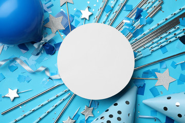 Flat lay composition with birthday decor and blank card on light blue background. Space for text