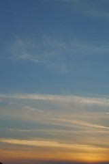 Obraz premium Summer sunset with clouds portrait