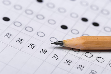testing in exercise and exam paper. computer sheet with pencil in school test room, education concept
