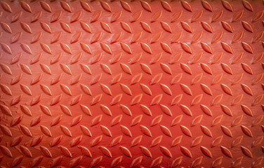 Texture of old metal diamond plates that have been red painted
