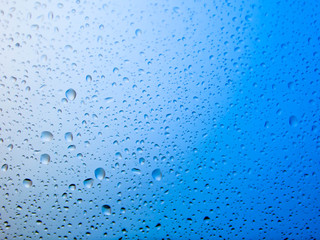 water drops on glass background.blue background.