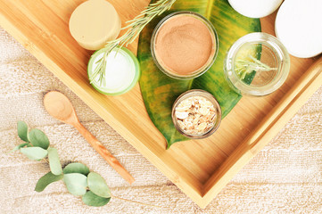 Natural ingredients top view wooden tray and bath towel, prepared for making cosmetics at home....