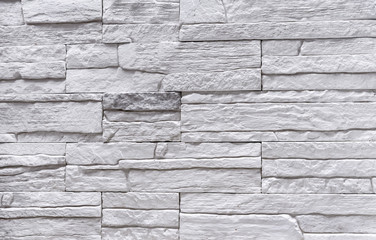 Texture of white facade stone for exterior decoration of the house.