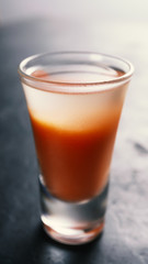 A cocktail of vodka, tomato juice and ice.