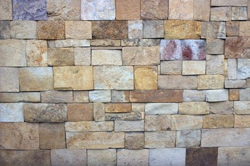  The stones of gray, brown and beige colors are laid out in panels. Good background for different needs