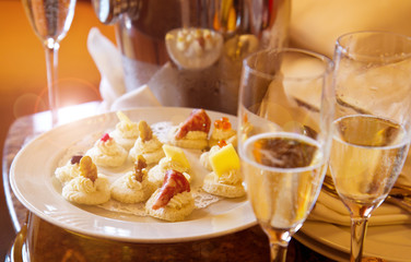 delicious champagne flute with dish of canape