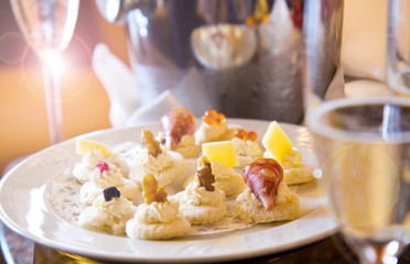 delicious champagne flute with dish of canape