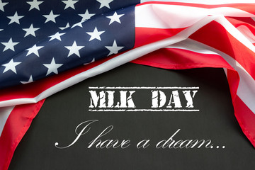 Fototapeta na wymiar Martin Luther King Day. Flag of USA on black background with text.