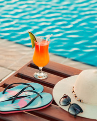 young woman holidays beach accessories on a wood background