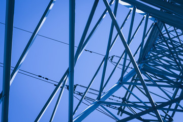 High voltage pole close up toned in color of the year 2020 classic blue