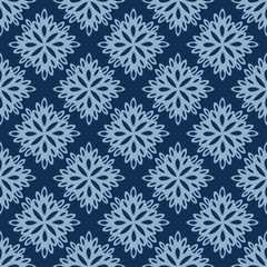 Naklejka na ściany i meble Seamless vector pattern of lacy paper flowers on classic blue background. Pretty hand drawn elements resembling paper cut outs can used as a backdrop, background, textile, paper and more.