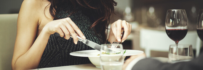 WOman having dinner in a luxury restaurant - detail